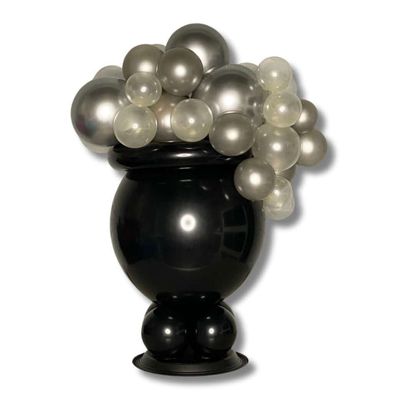 Witch Cauldron Halloween Balloon Centerpiece featuring black cauldron and silver and clear round bubble balloons