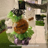 Ghostly Greetings Halloween Balloon Marquee features a Happy Halloween foil balloon, cute spider foil balloon, and two friendly ghosts sculptures with chrome purple and lime green balloons.