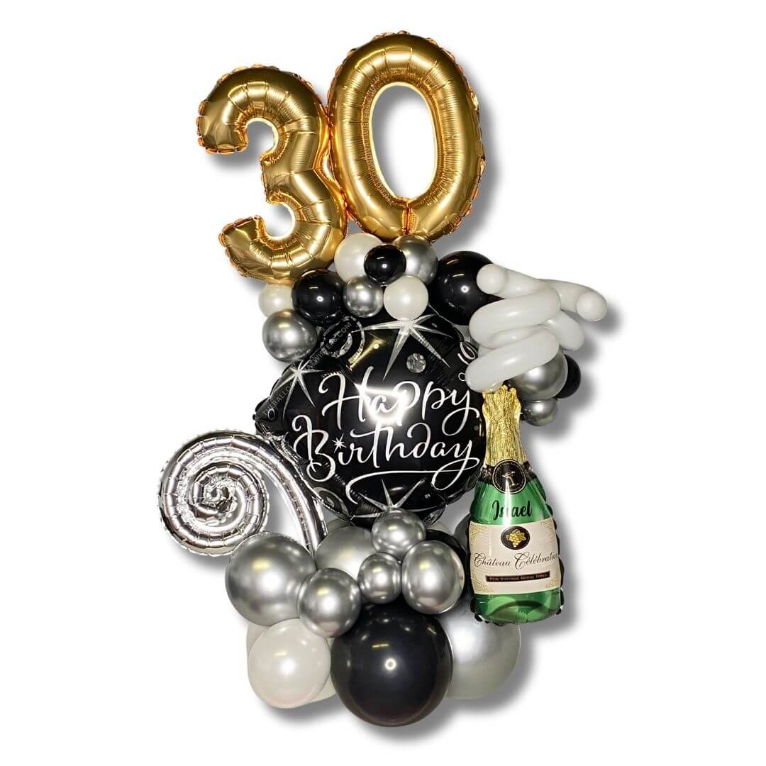 Champagne Celebration Birthday Balloon Marquee feature silver, pearl white, and black latex balloons, accented by a champagne foil balloon with the recipient's name and shimmering silver spiral foil balloon. A gold number foil balloon proudly displays the celebrant’s age.